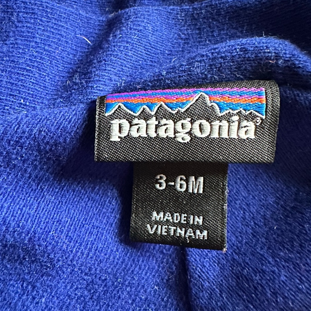 Patagonia 3-6 month wind/rain jacket. Fleece lined. Blue